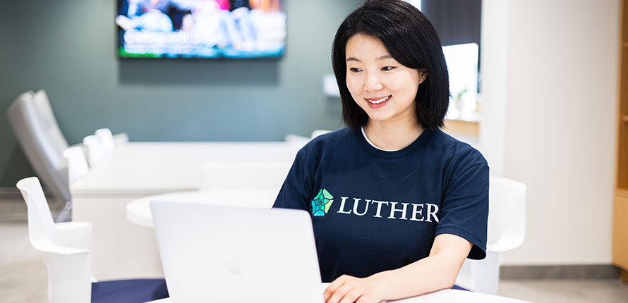 Female student working at laptop
