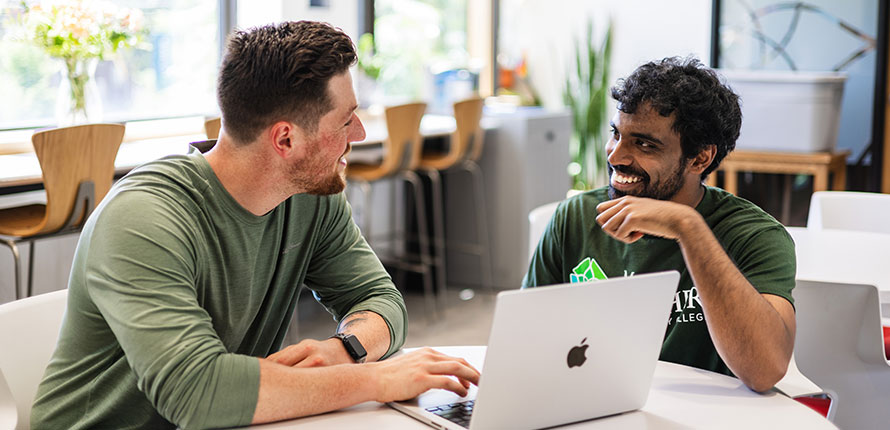 Two male students having a discussion