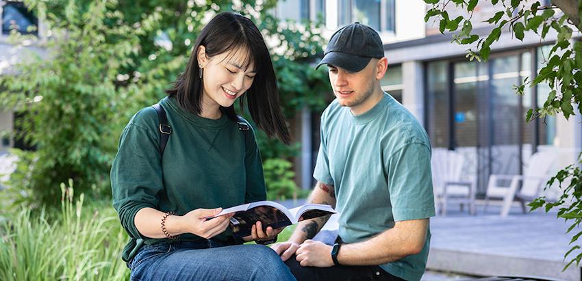 Luther students sitting outside studying