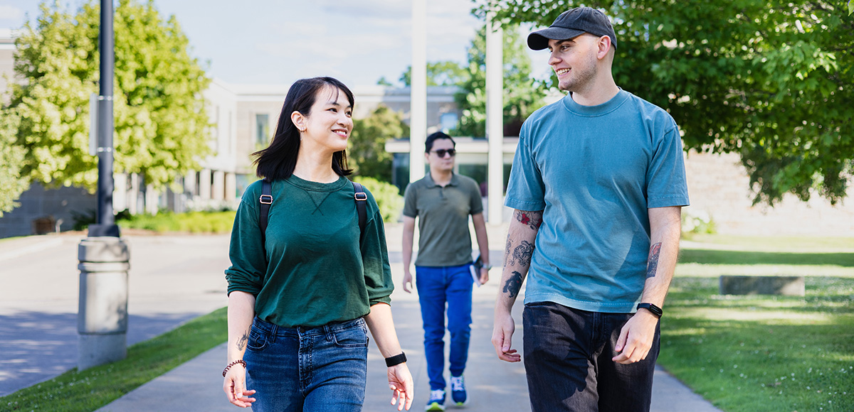 Students walking on campus in spring