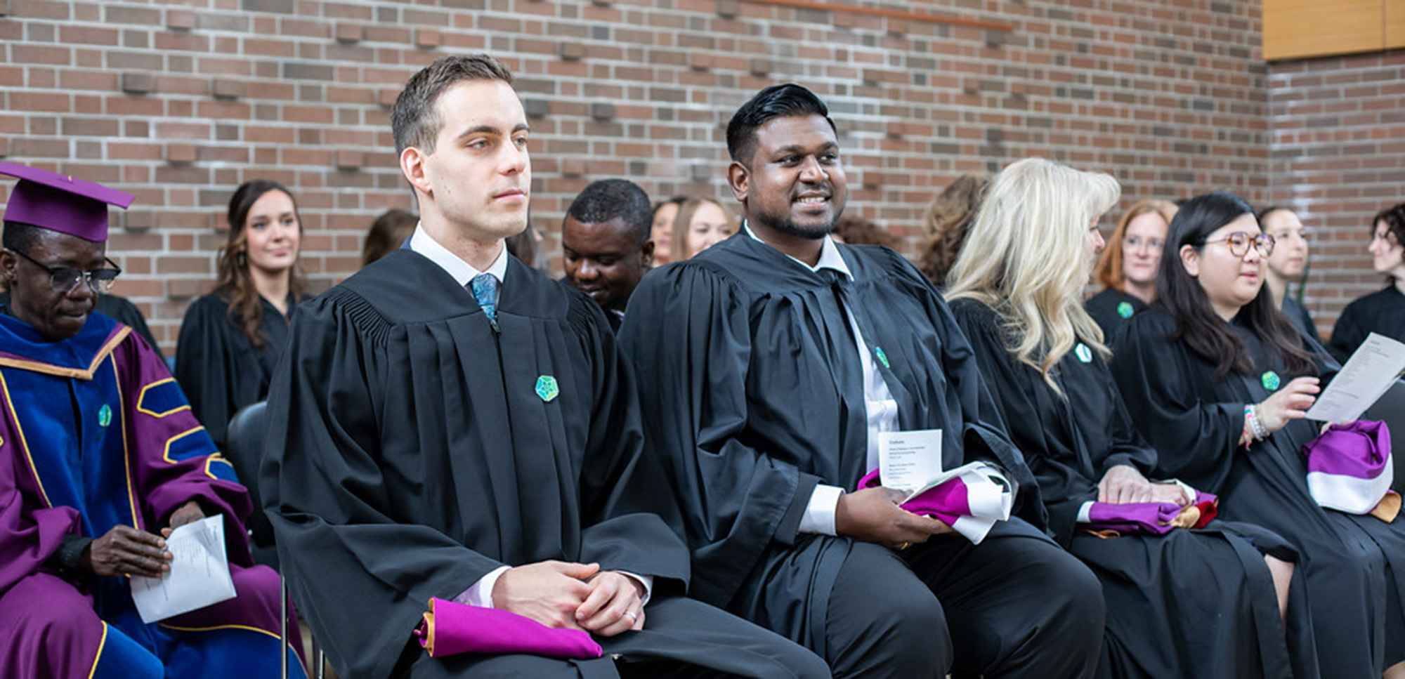 Graduates sitting during convocation ceremony
