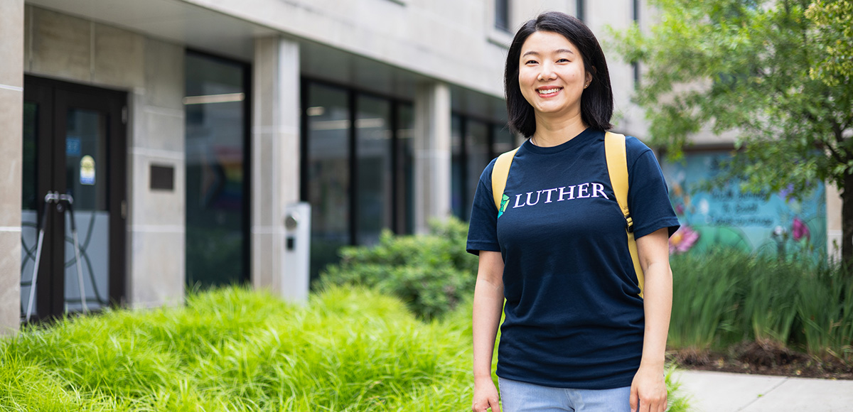 student in campus courtyard