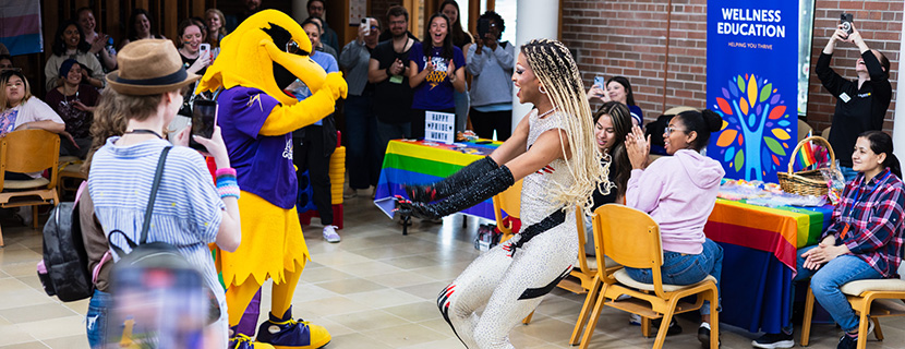 Hawk mascot and pride performer dancing