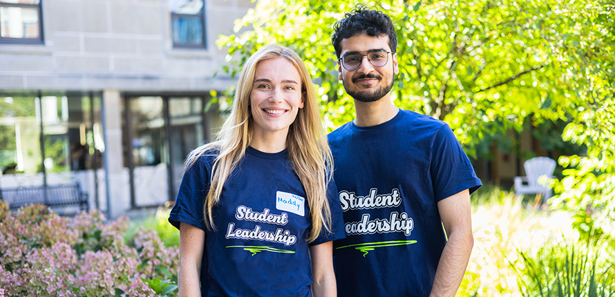 Student leaders smiling in campus courtyard