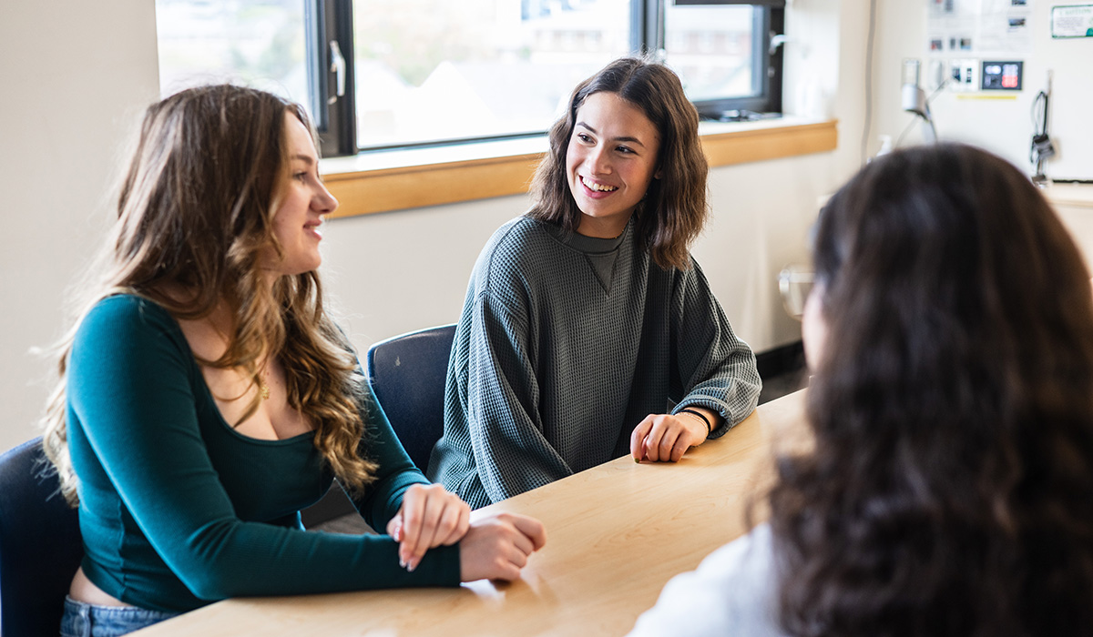 Student gathered and learning in class
